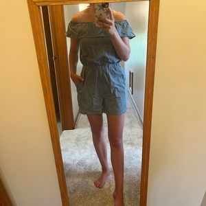 A denim blue romper with white stripes